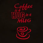 Detailansicht der Stickerei: Coffee is a hug in a mug